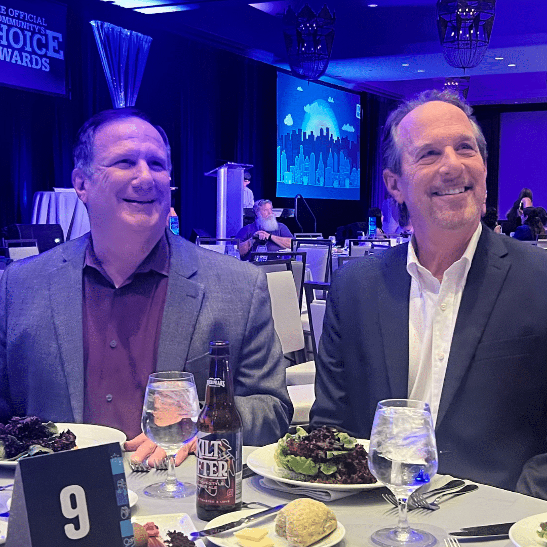 Two First Impression Ironworks team members sitting at a table at the Best of the Desert awards gala