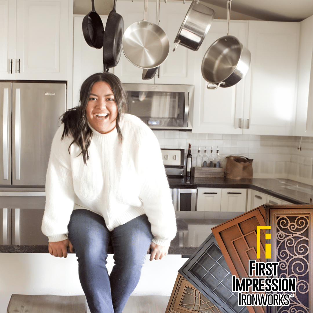 Homeowner sitting on her kitchen island smiling