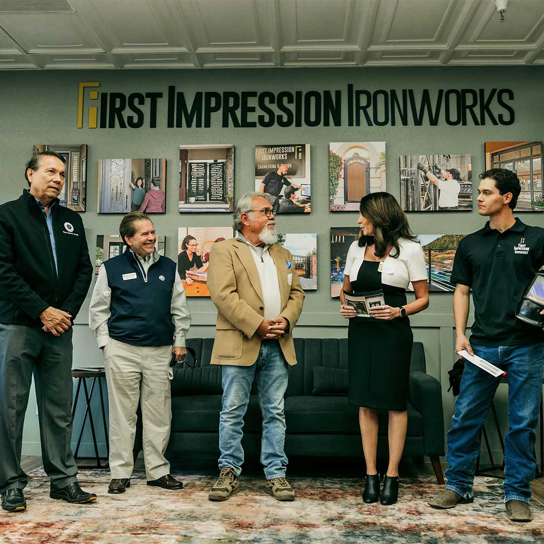 Group of people speaking about the First Impression Ironworks donation to the EVIT Foundation.