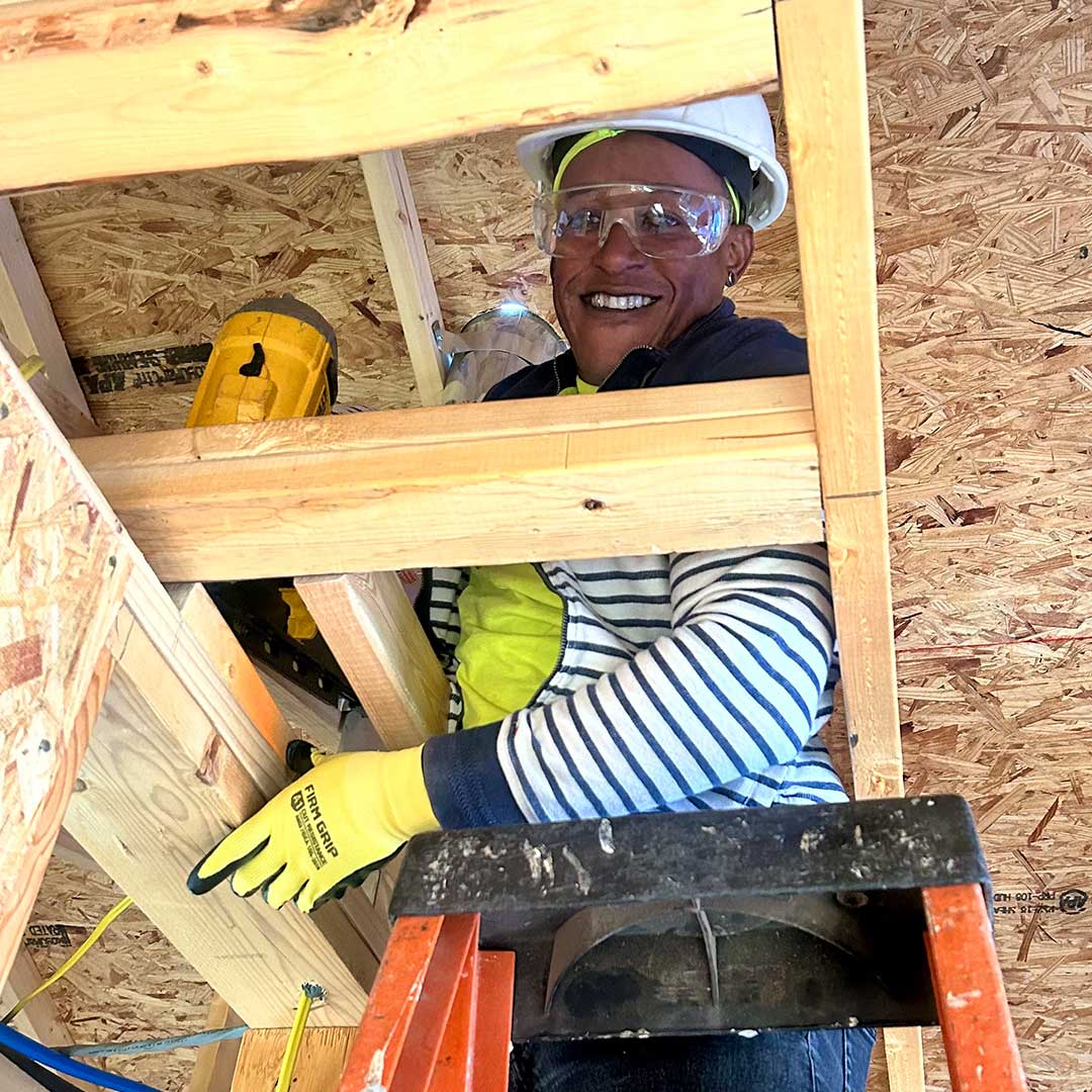 Member of First Impression Ironworks employee working on the framing of a home being built with Habitat for Humanity