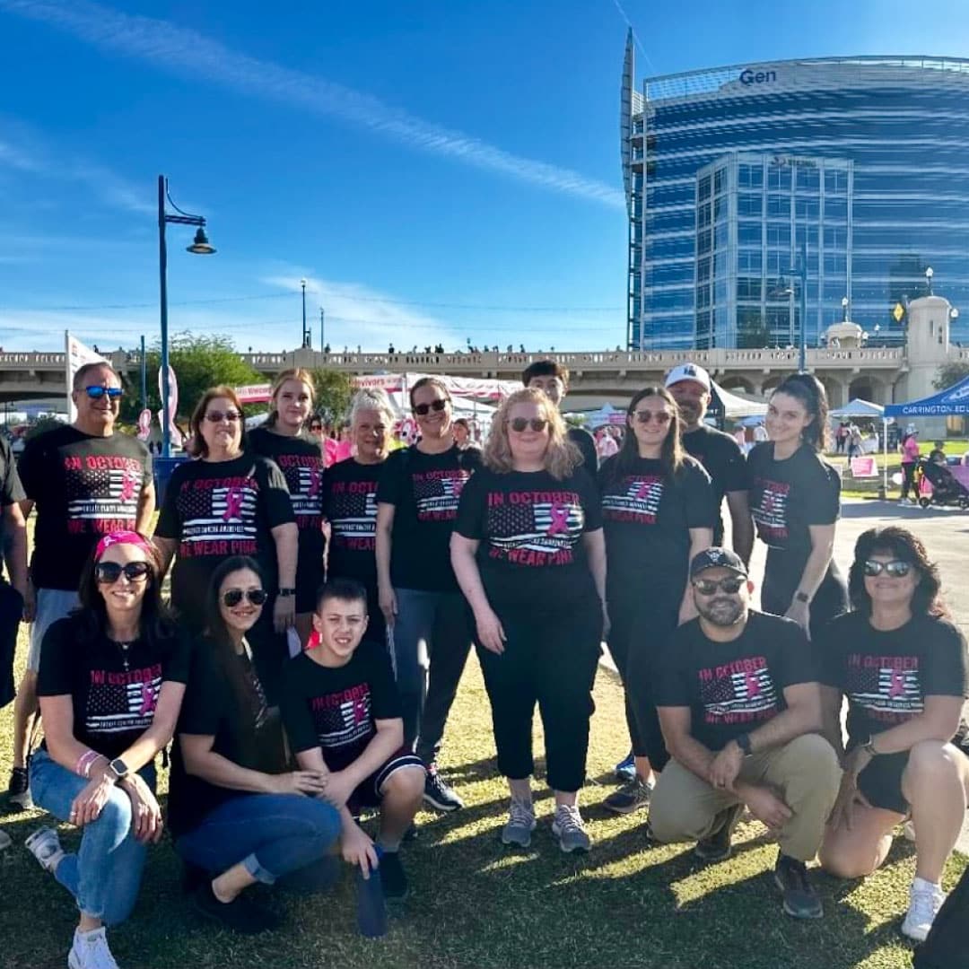 Large group of First Impression Ironworks team members posing for a picture at the Making Strides Breast Cancer event