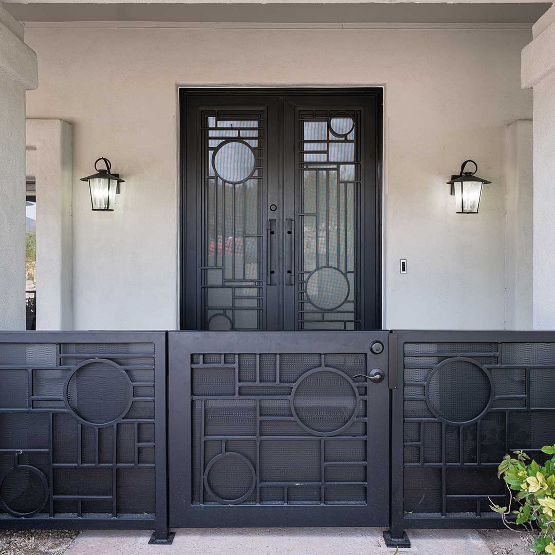 Entry of a home showing off the matching unique First Impression Ironworks entry gate and Iron Entry Door.